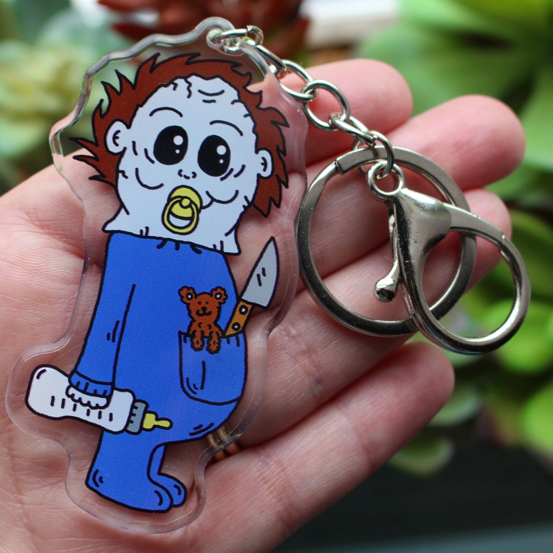 Baby Michael Myers Halloween Keychain. He has his pacifier, knife, bottle and killer teddy bear.