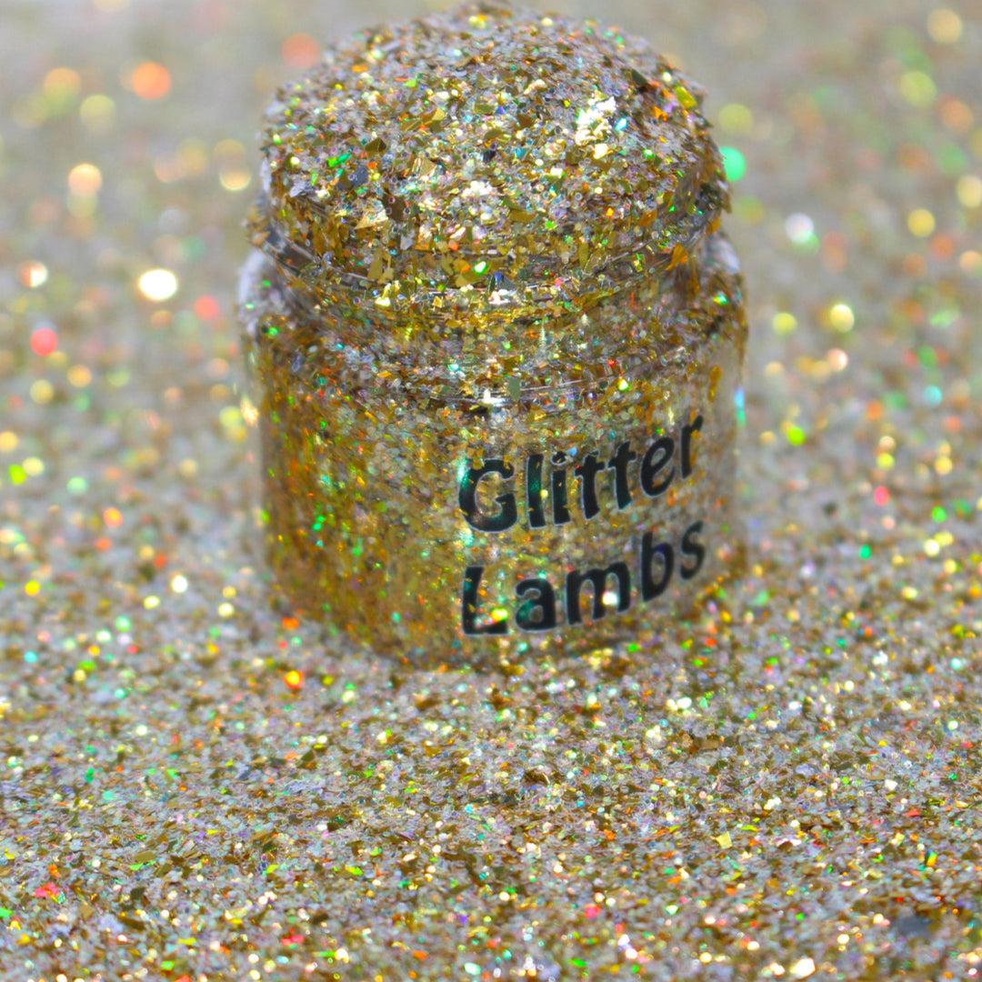 Gold holographic shard glitter called “Dear Santa, Define Good!,” packaged in a 5 gram bag, part of the Christmas Is Here glitter collection, perfect for nails, resin art, tumblers, ornaments, hair, body, and holiday crafts.