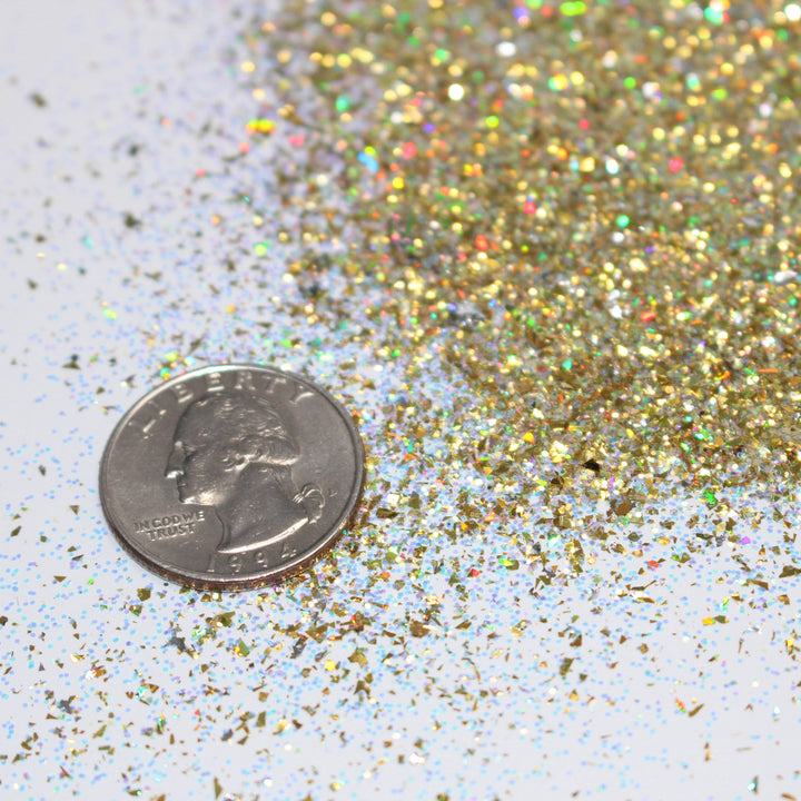 Gold holographic shard glitter called “Dear Santa, Define Good!,” packaged in a 5 gram bag, part of the Christmas Is Here glitter collection, perfect for nails, resin art, tumblers, ornaments, hair, body, and holiday crafts.