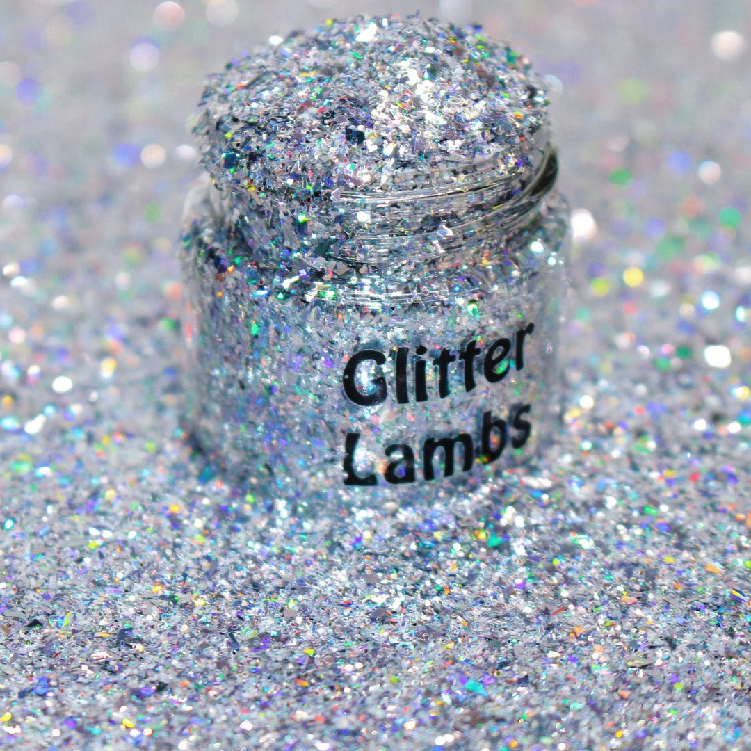 Silver holographic shard-cut glitter called “Don’t Make Me Text Santa,” packaged in a 5 gram bag, part of the Christmas Is Here glitter collection, perfect for nails, resin art, tumblers, and holiday crafts.