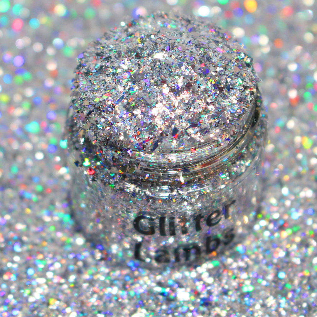 Silver holographic shard-cut glitter called “Don’t Make Me Text Santa,” packaged in a 5 gram bag, part of the Christmas Is Here glitter collection, perfect for nails, resin art, tumblers, and holiday crafts.