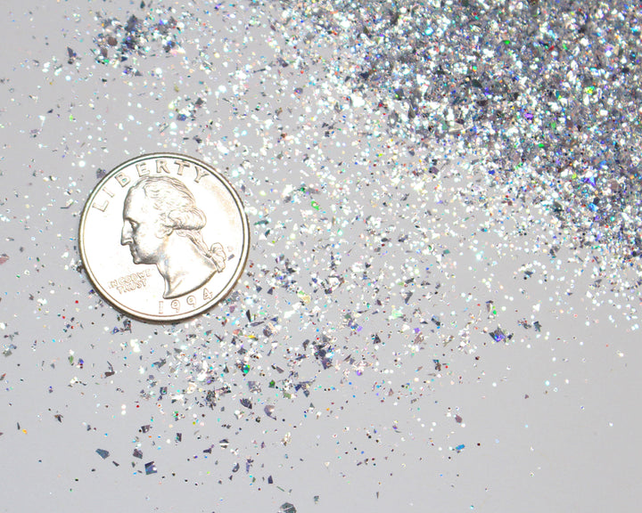 Silver holographic shard-cut glitter called “Don’t Make Me Text Santa,” packaged in a 5 gram bag, part of the Christmas Is Here glitter collection, perfect for nails, resin art, tumblers, and holiday crafts.