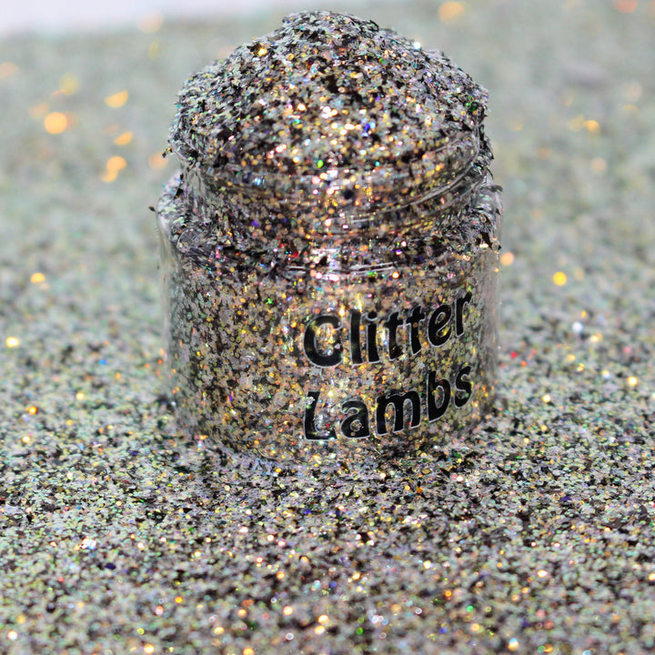 Gold holographic glitter with blue accents called “I Run On Coffee & Christmas Cheer,” packaged in a 5 gram bag, part of the Christmas Is Here glitter collection, perfect for nails, resin art, tumblers, ornaments, hair, body, and holiday crafts.