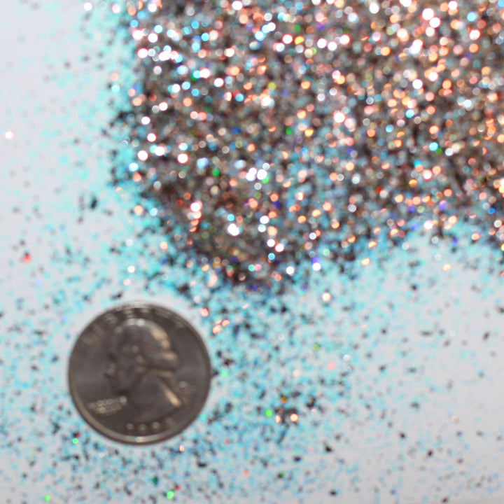 Gold holographic glitter with blue accents called “I Run On Coffee & Christmas Cheer,” packaged in a 5 gram bag, part of the Christmas Is Here glitter collection, perfect for nails, resin art, tumblers, ornaments, hair, body, and holiday crafts.