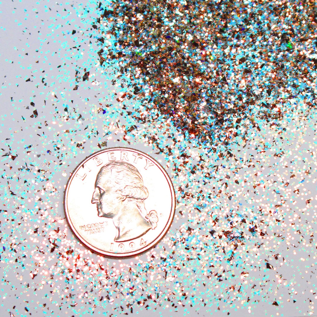 Gold holographic glitter with blue accents called “I Run On Coffee & Christmas Cheer,” packaged in a 5 gram bag, part of the Christmas Is Here glitter collection, perfect for nails, resin art, tumblers, ornaments, hair, body, and holiday crafts.