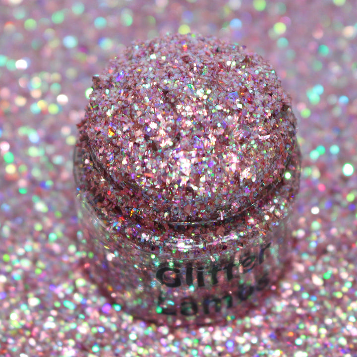 Pink holographic shard-cut glitter called “Keep Your Holiday Diet Balanced…A Cookie In Each Hand,” packaged in a 5 gram bag, part of the Christmas Is Here glitter collection, perfect for nails, resin art, tumblers, ornaments, and holiday crafts.