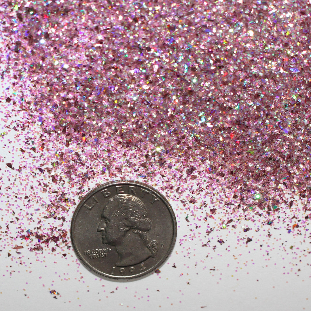 Pink holographic shard-cut glitter called “Keep Your Holiday Diet Balanced…A Cookie In Each Hand,” packaged in a 5 gram bag, part of the Christmas Is Here glitter collection, perfect for nails, resin art, tumblers, ornaments, and holiday crafts.