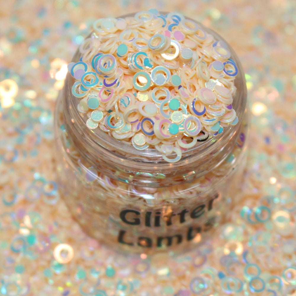 Peach Fuzz Glitter by GlitterLambs.com These are peach colored glitter sequin hollow ring circles in a size 3mm.