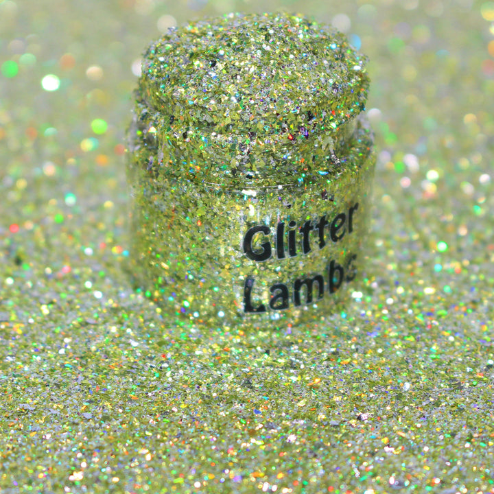 Gold holographic shard glitter called “Pour Me Some Holiday Cheer,” packaged in a 5 gram bag, part of the Christmas Is Here glitter collection, perfect for nails, resin art, tumblers, ornaments, hair, body, and holiday crafts.