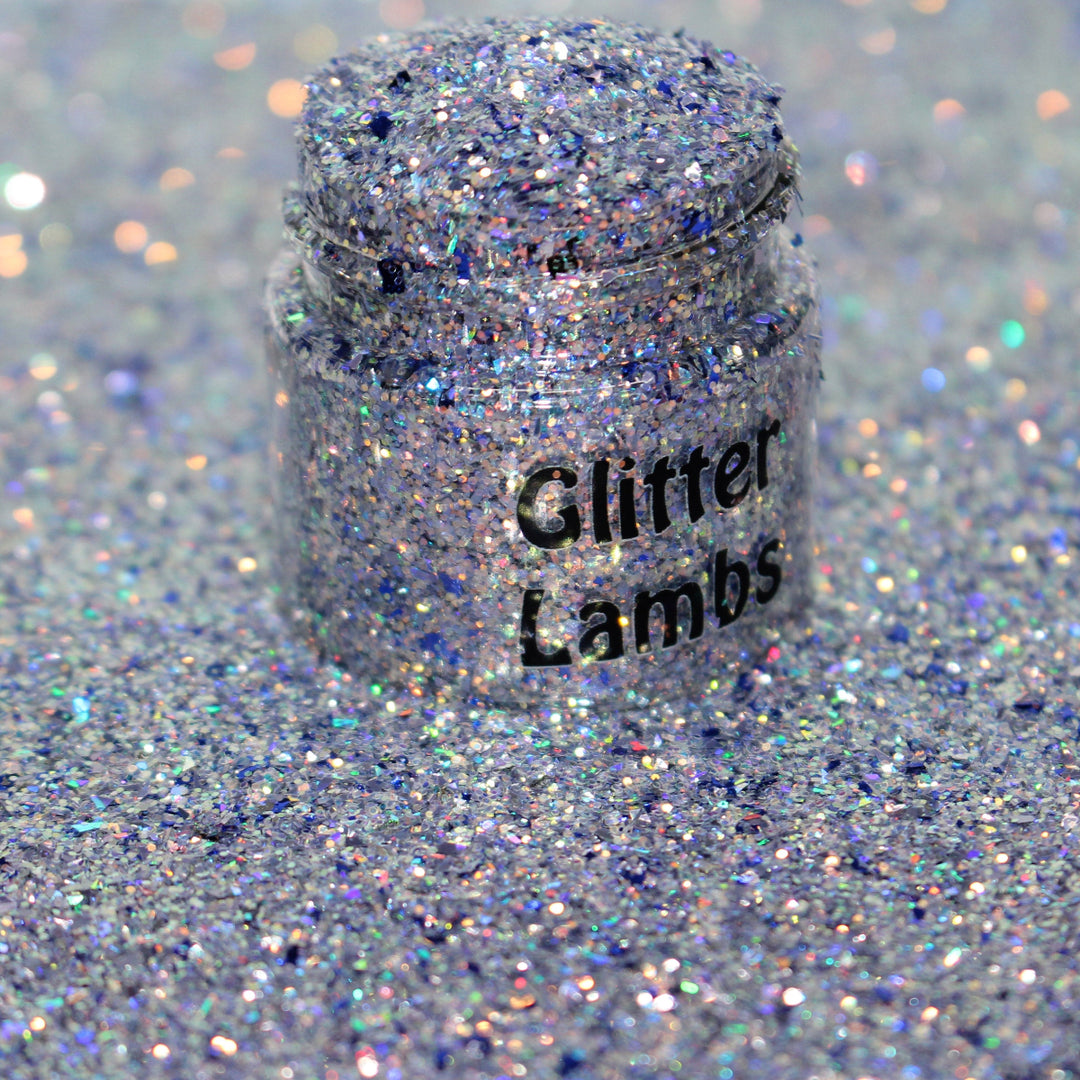 Lilac purple holographic shard glitter called “Santa I Was Framed,” packaged in a 5 gram bag, part of the Christmas Is Here glitter collection, perfect for nails, resin art, tumblers, ornaments, hair, body, and holiday crafts.