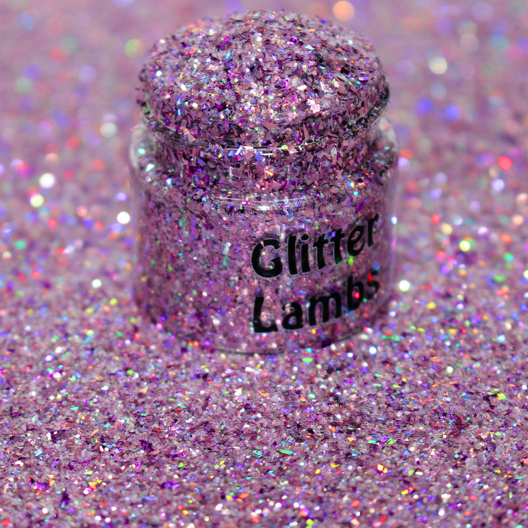 Purple holographic shard glitter called “Santa They Are The Naughty Ones,” packaged in a 5 gram bag, part of the Christmas Is Here glitter collection, perfect for nails, resin art, tumblers, ornaments, hair, body, and holiday crafts.