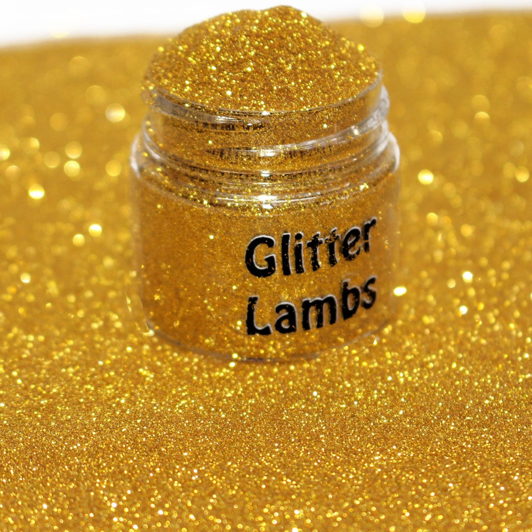 Splashed In Gold is a yellow gold metallic hex glitter in a size .004 by GlitterLambs.com