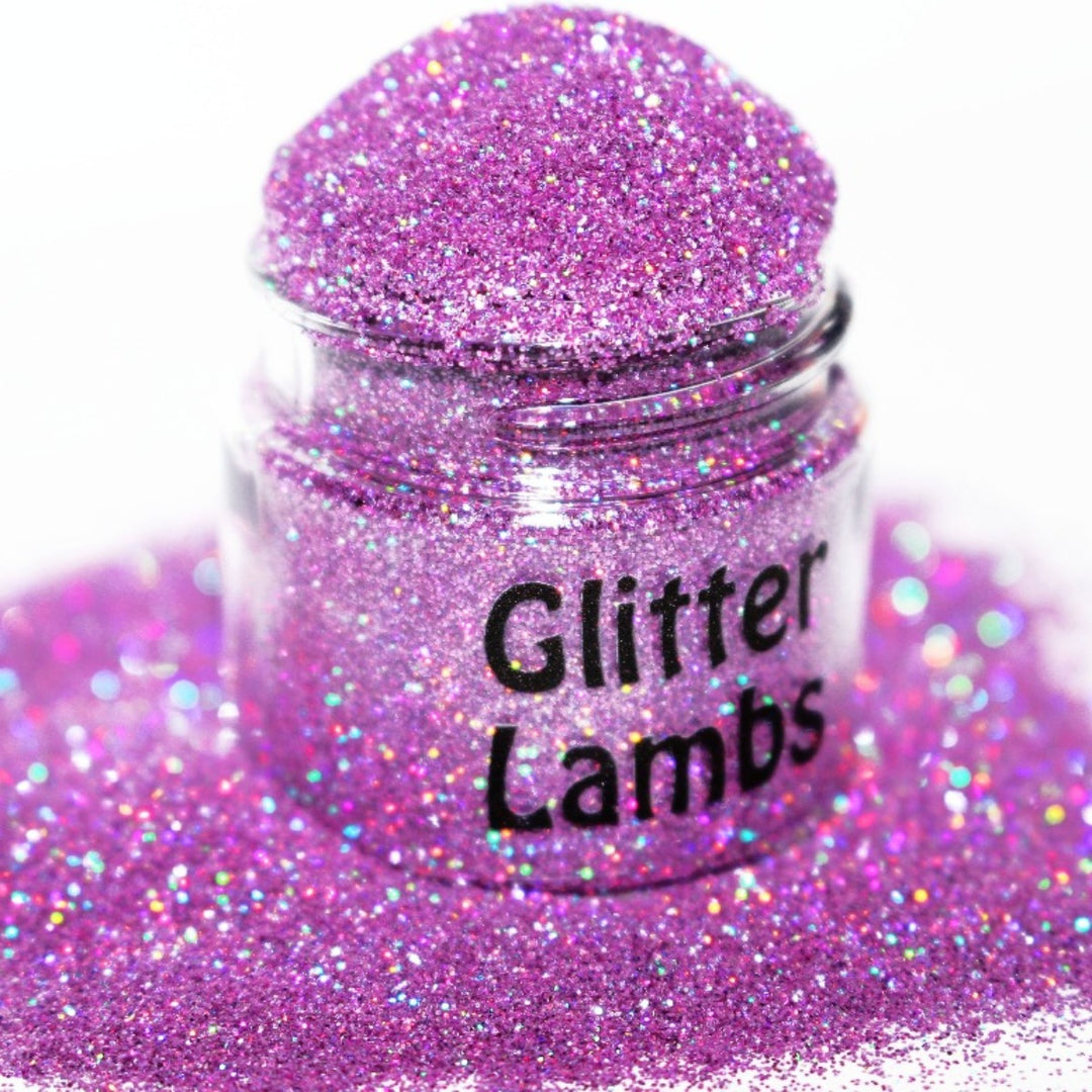 Here Kitty Kitty Glitter. A pink holographic glitter that is a size .008. Great for crafts, nails, resin, acrylic pouring, tumbler cups, body, etc. by GlitterLambs.com