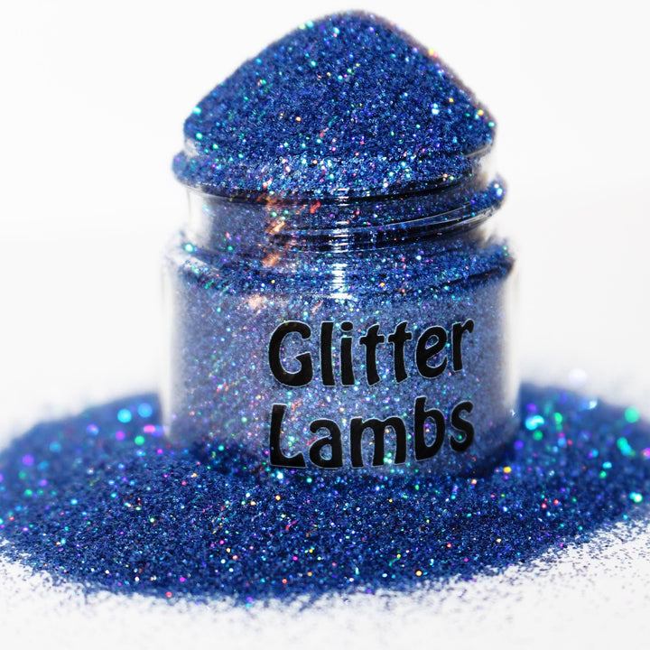 Baby Monster Went Blueberry Picking Glitter. This blue holographic glitter size is .008. Great for crafts, nails, resin, etc. by GlitterLambs.com